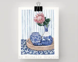 Blue and White vignette with protea on rattan tray