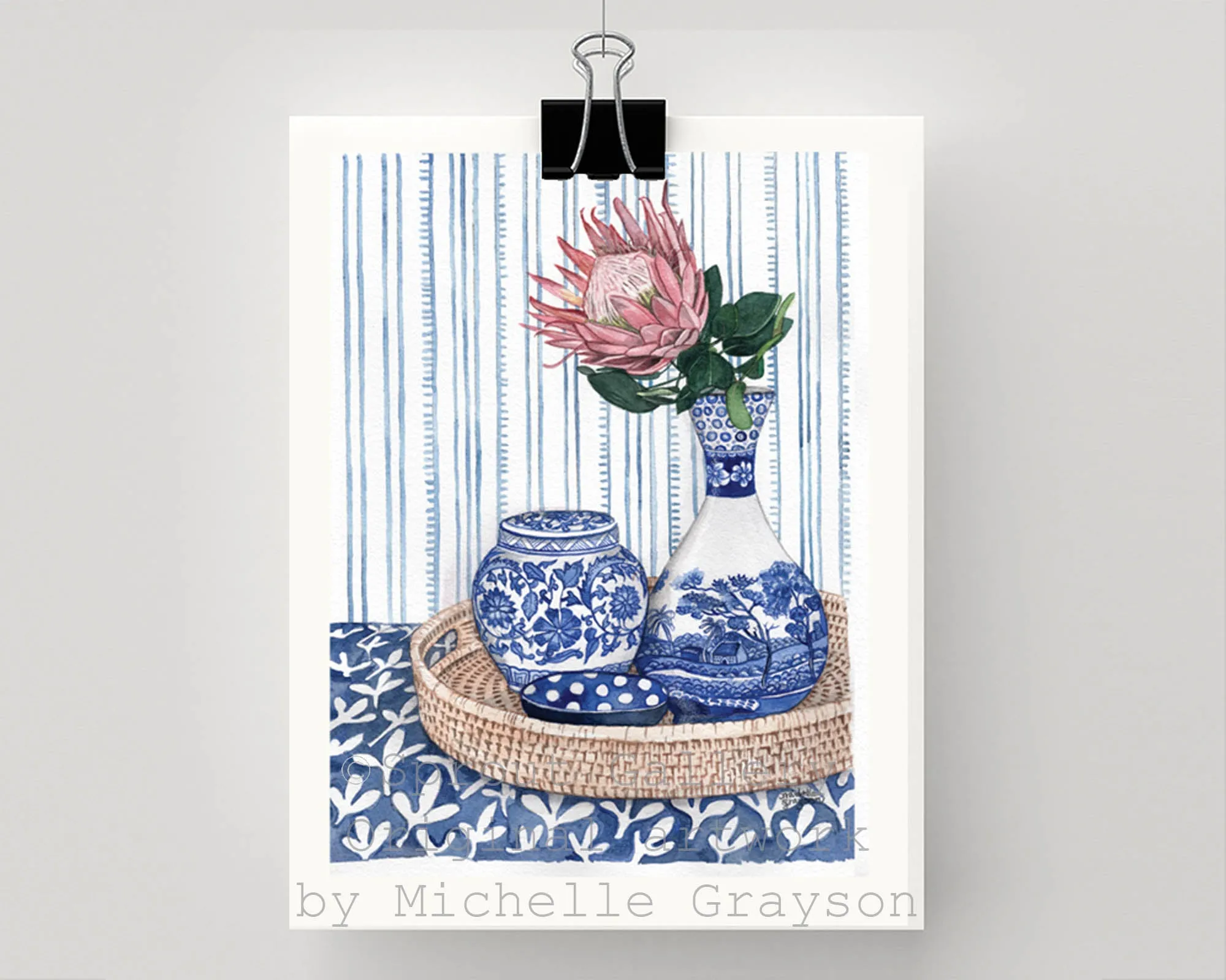 Blue and White vignette with protea on rattan tray