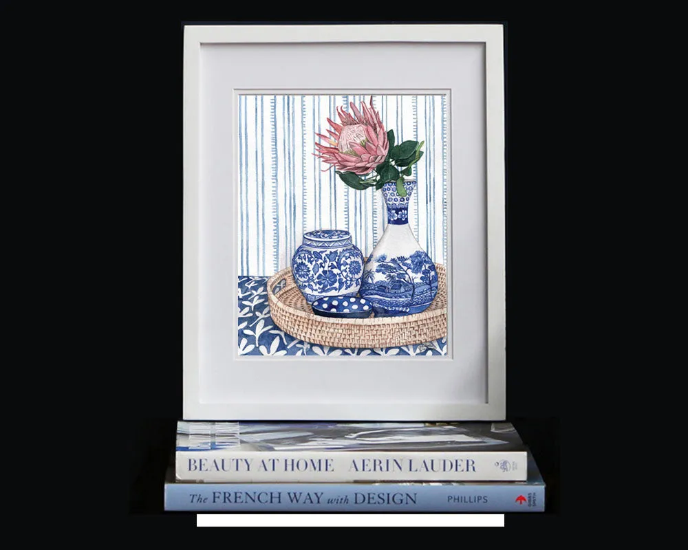 Blue and White vignette with protea on rattan tray