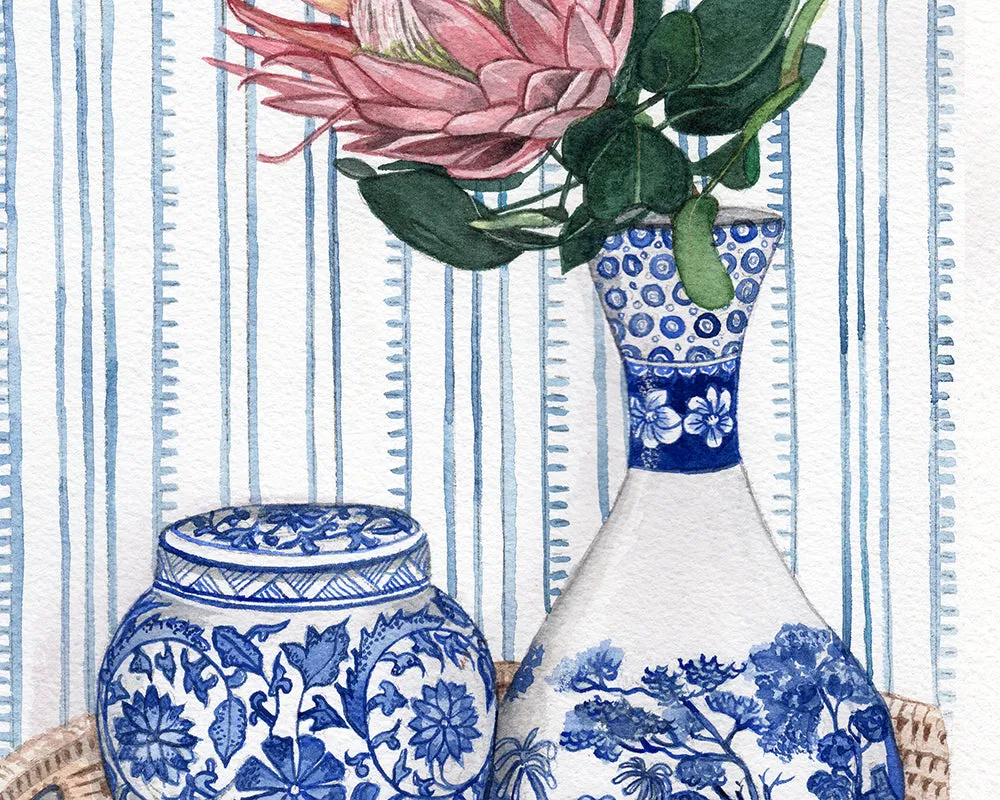 Blue and White vignette with protea on rattan tray